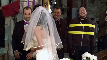 Sal watches his sister walk the aisle with Murr while strapped to a hand truck.